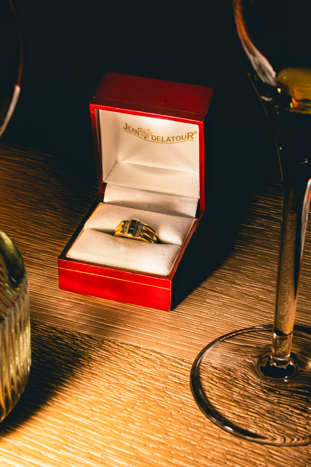 product photography of a red ring binder with an engagement ring inside